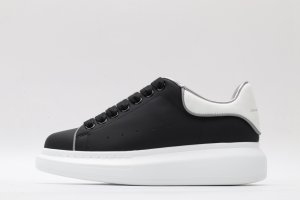 ALEXANDER MCQUEEN oversized black sneakers with white heel