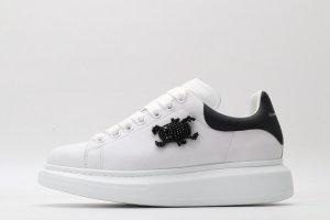 ALEXANDER MCQUEEN white oversized sneakers with black heel
