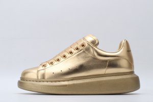 ALEXANDER MCQUEEN Gold oversized sneakers