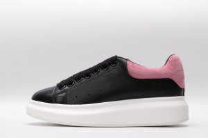 ALEXANDER MCQUEEN oversized black sneakers with rose heel